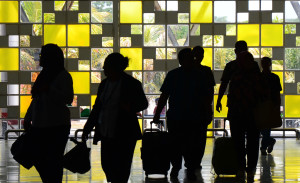 Sejumlah penumpang keluar dari terminal keberangkatan di Bandara Internasional Lombok di Praya, 